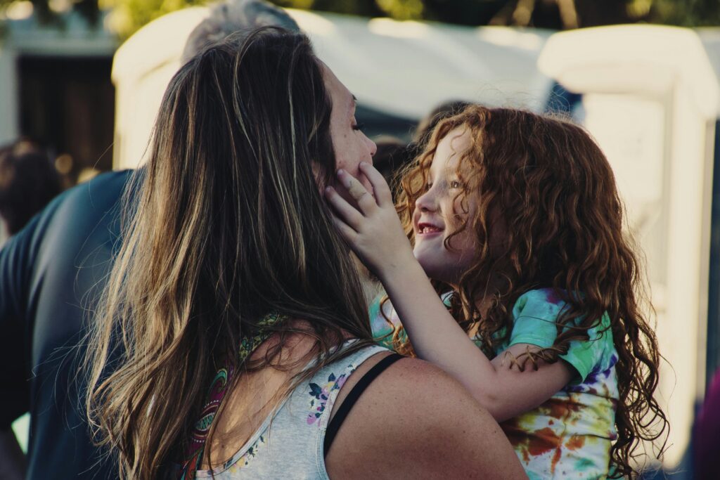 A mother and child sharing a quiet moment together at home.